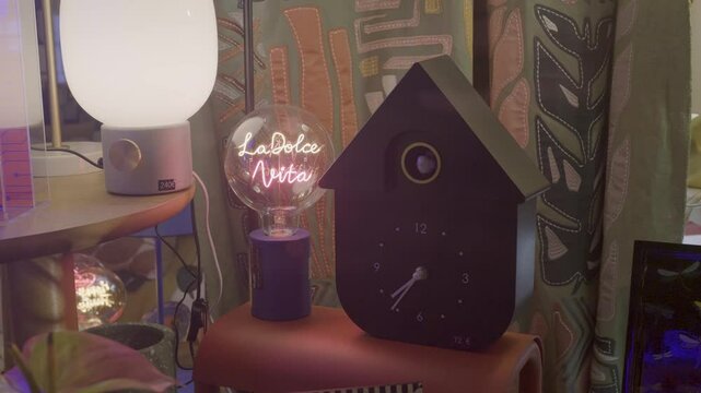 A cozy Parisian living room featuring decorative lights and unique clock design