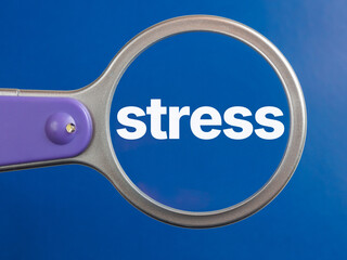 Stress text through magnifying glass blue background