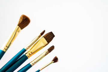 selection of watercolor and oil paint brushes - art supplies with copy space