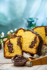 Panettone is the traditional Italian dessert for easter in 2021. Homemade panettone covered in chocolate and sprinkles. Bread served as dessert.