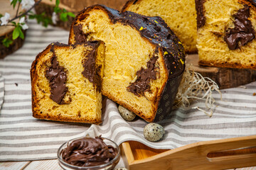 Panettone is the traditional Italian dessert for easter in 2021. Homemade panettone covered in chocolate and sprinkles. Bread served as dessert.