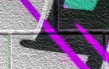 vivid street graffiti texture of colotful spray painting strips on gray metallic brick background, urban culture of modern youth backdrop