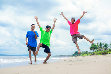 Three Young Men Enjoying a Sunny Beach Day