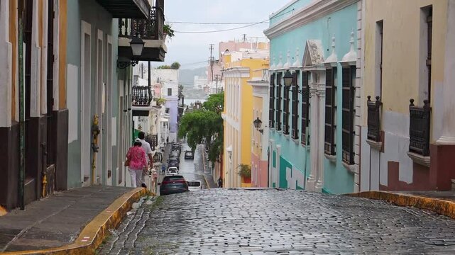 street with colorful buildings, and people walking on the streetside in San Juan, Puerto Rico
