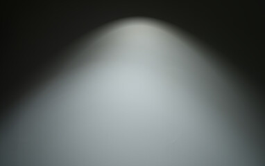 Cement texture background, light shines from above in the center (center focus)