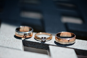 Close-up of a wedding ring set including an engagement ring, beautifully displayed under sunlight...