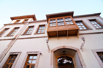 Traditional House Architecture with Wooden Bay Windows..