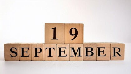 Minimalist photo of wooden blocks with date 19 September. Day and month, calendar on white background