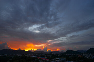 Stunning Sunset Skyline Over a City With Vibrant Colors and Dramatic Clouds..