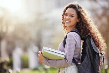 University, books and portrait of woman in park on campus for learning, education and knowledge outdoors. Backpack, college and confident female student on school, academy and studying in nature