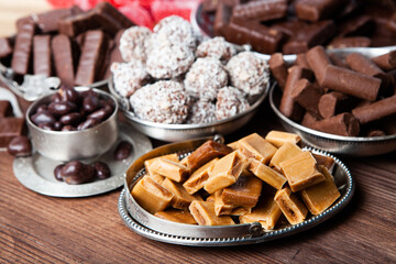 Assortment of sweet confectionery with chocolate candies and pralines. Children's holiday table with chocolate sweets