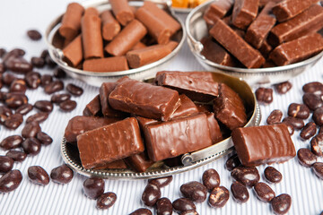 Assortment of sweet confectionery with chocolate candies and pralines. Children's holiday table with chocolate sweets