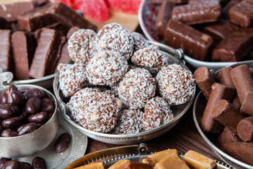 Assortment of sweet confectionery with chocolate candies and pralines. Children's holiday table with chocolate sweets