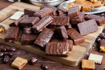 Assortment of sweet confectionery with chocolate candies and pralines. Children's holiday table with chocolate sweets