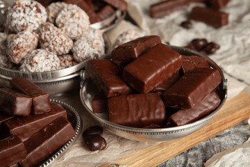 Assortment of sweet confectionery with chocolate candies and pralines. Children's holiday table with chocolate sweets