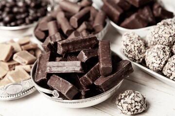 Assortment of sweet confectionery with chocolate candies and pralines. Children's holiday table with chocolate sweets