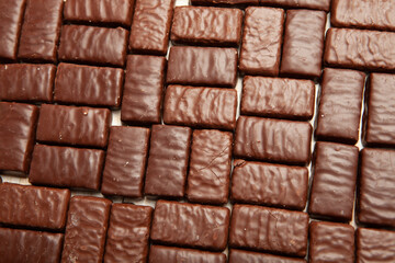Assortment of sweet confectionery with chocolate candies and pralines. Children's holiday table with chocolate sweets