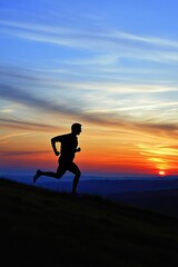 Fototapeta premium Silhouette of Runner at Sunset, Majestic Mountain Landscape, Stunning Sky, Active Lifestyle, Outdoor Exercise, Scenic View