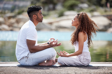 Beach, couple and lotus pose for meditation, mindfulness and holistic wellness outdoor. People, man and woman with zen for bonding in California to relax, peace and mental health in relationship