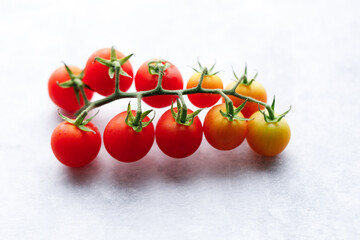 Fresh red cherry tomato on white background.