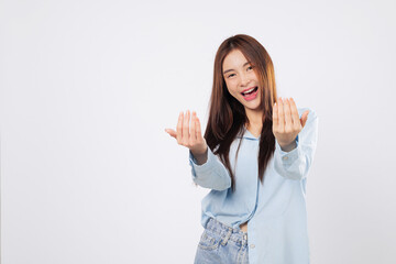 Woman uses hand gesture to beckon come here, while another woman stands with palm extended in a...