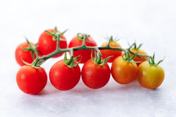 Fresh red cherry tomato on white background.