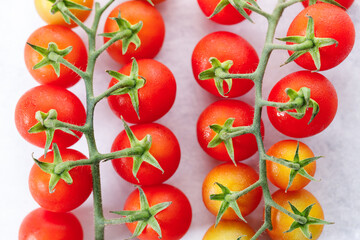Fresh red cherry tomato on white background.