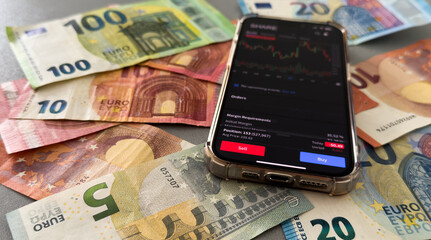 Crypto trader investor broker using cell phone app executing financial stock trade market trading...