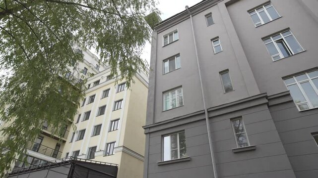 Facade of minimalist office building stands sleek and modern. Futuristic along with functional design blends seamlessly into urban landscape