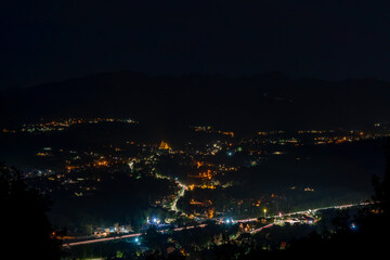 Fototapeta premium Summer Dusk City Lights of Zakopane with Tatra Mountain Backdrop