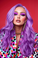 Obraz premium A woman with long purple hair wearing a colorful polka dot jacket