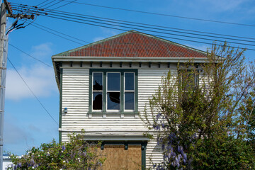 Abandoned Wooden House with Broken Window