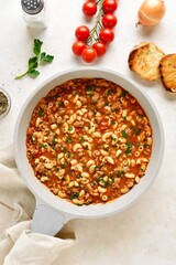 One pot meal with ground beef, pasta and vegetables simmered in tomato sauce