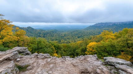 Obraz premium breathtaking view of lush valley surrounded by mountains, showcasing vibrant autumn foliage