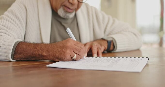 Hands, signature and senior man with paper, form or legal compliance for will or title deed in house closeup. Documents, pen and elderly male person with application for pensioner housing contract