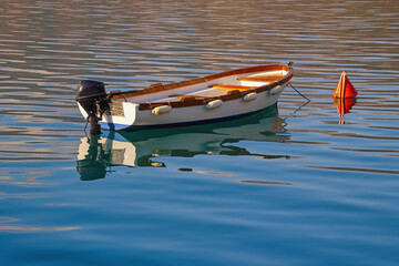 Fishing boat on calm water background