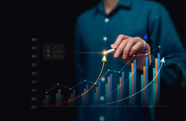 Businessman analyzes profits from charts for goals and highlights in 2026 and 2027. Study strategies for organizational development and for forecasting future business markets for long-term leadership