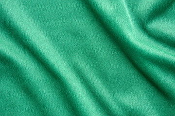 Green sports clothing fabric football shirt jersey texture close up