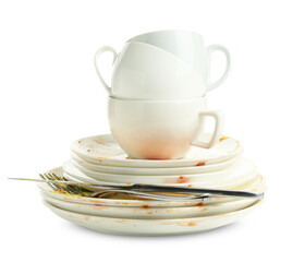 Dirty dishes, cups and cutlery isolated on white