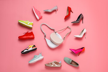 Clock made with women's shoes and bags on pink background, flat lay