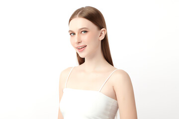 A beautiful young woman with clean, fresh skin against a white background. Skincare, facial treatment, cosmetology, beauty, and spa. An elegant portrait of an woman.