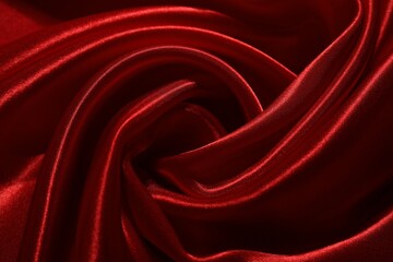 Red crumpled silk fabric as background, top view