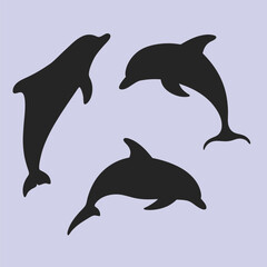 Naklejka premium Dolphins set vector silhouette in different styles.