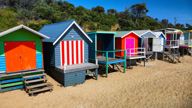 A row of beach houses on a sunny day on an Australian beach, seen from above