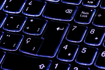 Close up of the enter key. Selective focus of the intro key on the laptop keyboard