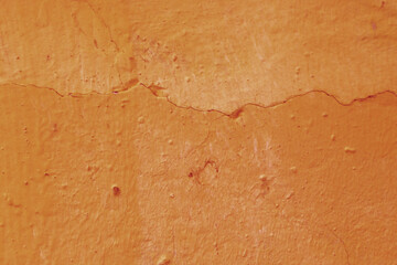 Old grunge orange wall texture background.
