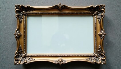 Ornate filigree pattern in gold and silver surrounding a antique glass photo frame , silver, gold