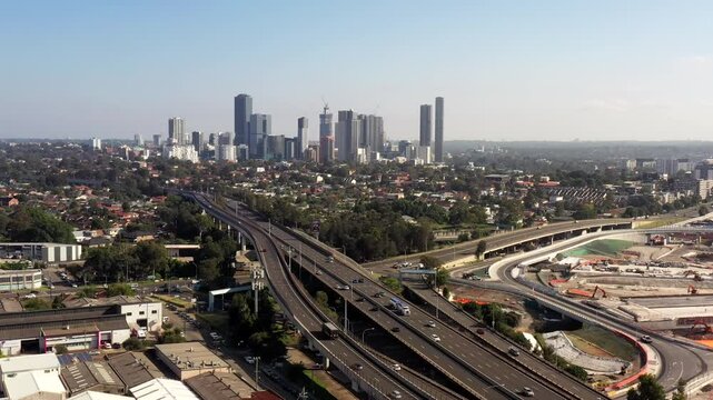 Intersection on Motorway M4 in Western Sydney at Parramatta CBD in aerial 4k.
