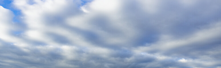 The sky is cloudy and the sun is not visible
