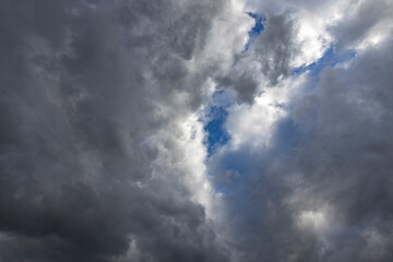 The sky is cloudy and the sun is shining through the clouds